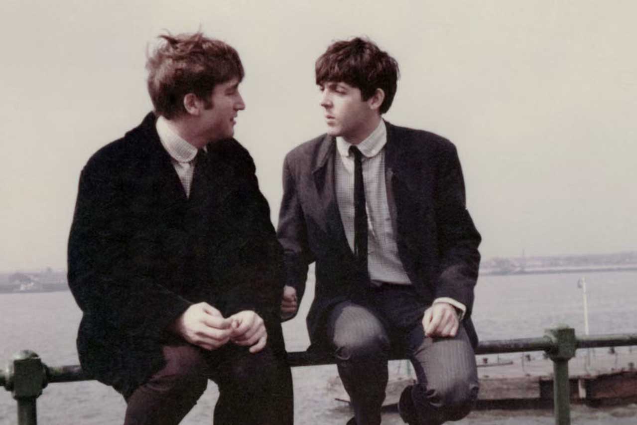 John Lennon and Paul McCartney (right) by the Mersey in Liverpool, 1963. Photograph: Paul Popper/Popperfoto/Getty Images