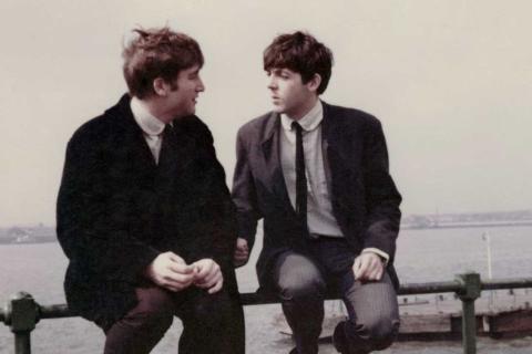 John Lennon and Paul McCartney (right) by the Mersey in Liverpool, 1963. Photograph: Paul Popper/Popperfoto/Getty Images