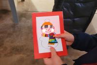 Il biglietto d'auguri col pupazzo di neve luminoso